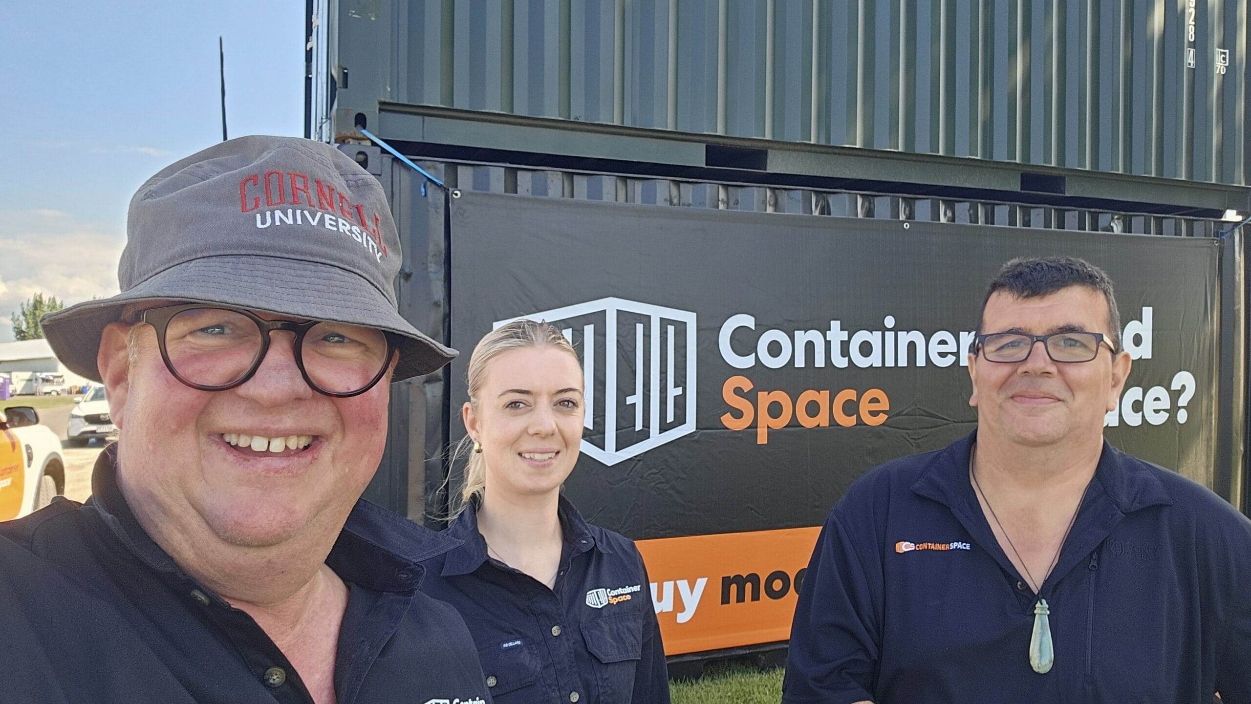 Container Space team members Libby and Deon give a thumbs up infront of one of our shipping container beauties.