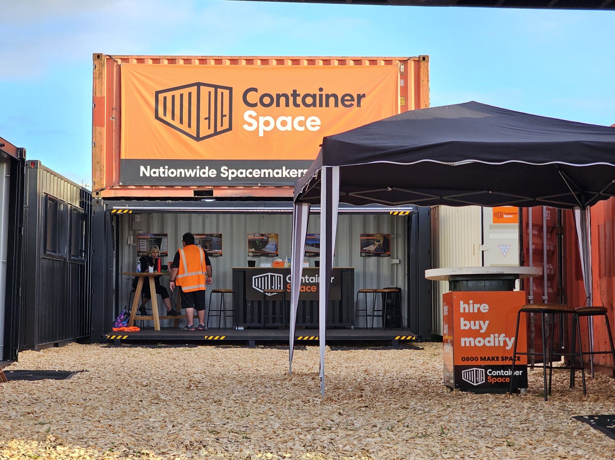 Container Space team members Libby and Deon give a thumbs up infront of one of our shipping container beauties.