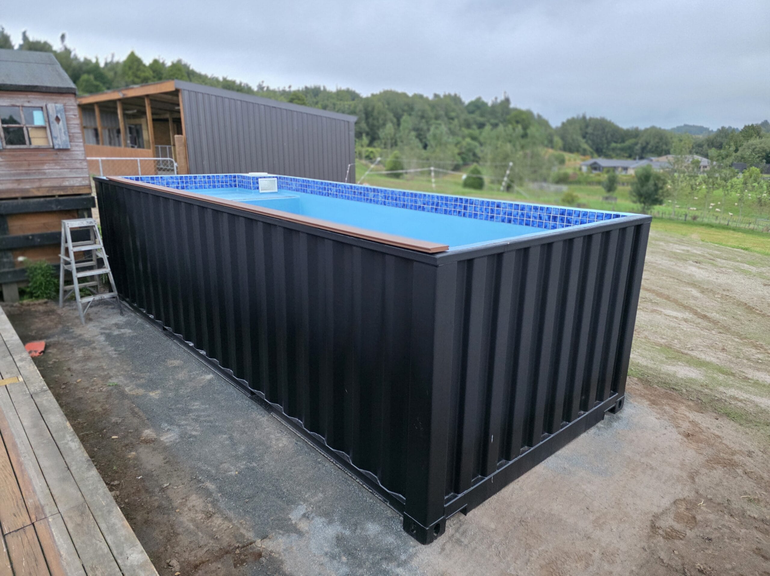Container Space team members Libby and Deon give a thumbs up infront of one of our shipping container beauties.